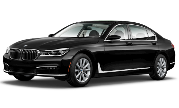 Home 3 A black BMW sedan is parked, viewed from a front angle, showing its sleek design and chrome accents—perfect for a sophisticated limo service in Houston.